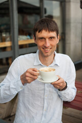 joyful cheerful middle-aged man in nature on a warm sunny day