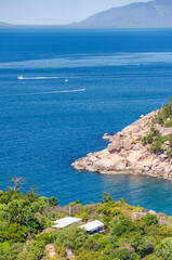 Picturesque golden sandy Alma Beach with granite boulders and turquoise water on Magnetic Island, Queensland, Australia.