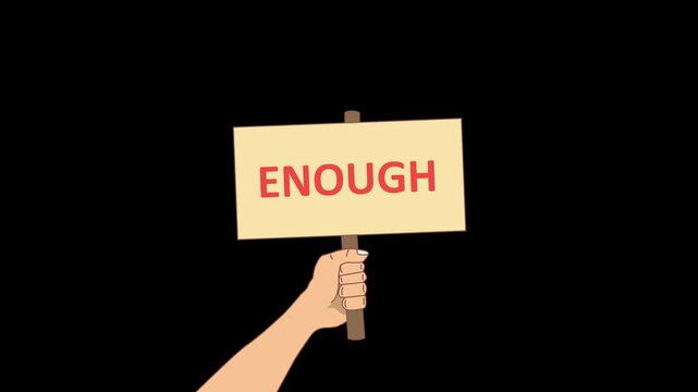 a hand holding a sign with enough text