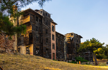 Abandoned Principe Orphanage wooden building in Turkey. An abandoned wooden building stands on a hill on Buyukada island.