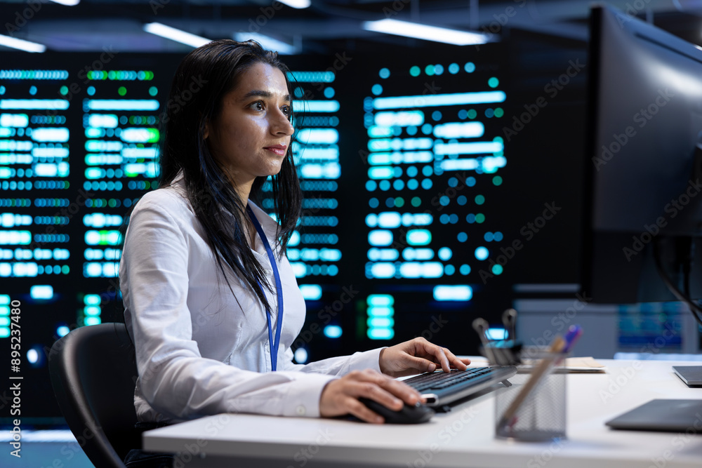 Poster indian woman doing yearly checkup to prolong data center electronics life span and avoid downtime. i