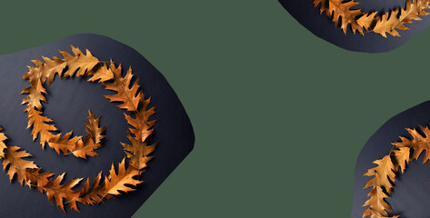 Withered red oak leaves on a dark background. Unfolding leaf spiral composition. Autumn...