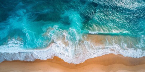 The ocean waves are the background of this beautiful summer vacation vacation holiday photo. An aerial view from the top down of the beach and the sea can be seen in the distant background.