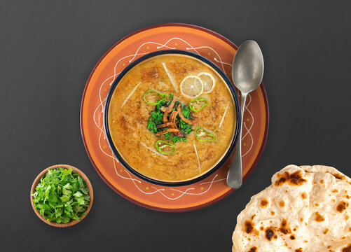 Spicy chicken haleem with fried onion, naan, roti served in dish isolated on background top view of indian spices and pakistani food