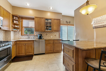Images of Kitchen with cabinets island appliances cooking and baking