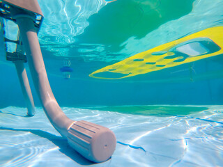 pool ladder with an air mattress floating on a swimming pool on the background
