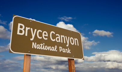 Bryce Canyon National Park (Utah) Road Sign Against Blue Sky and Clouds.
