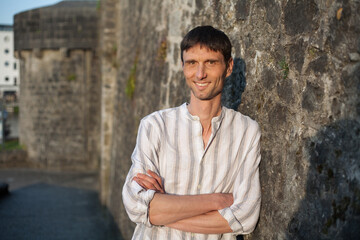 joyful cheerful middle-aged man in nature on a warm sunny day