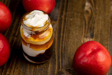 natural yogurt in a glass jar with fruits