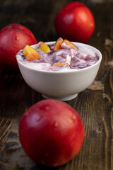 natural yogurt in a white bowl with fruits