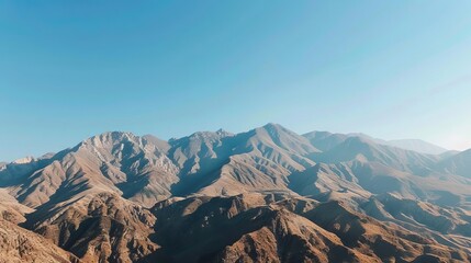 Philosophical Realism A detailed mountain range under a clear blue sky