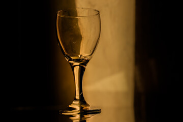empty wine glass in low light