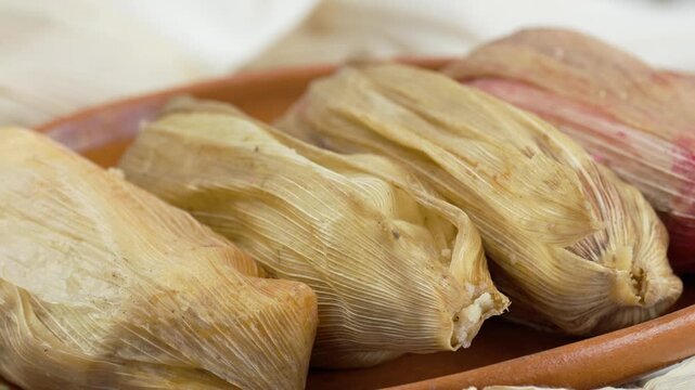 Tamales from mexico, different flavors like mole, rajas, dulce and salsa verde, Travel shot right Close up