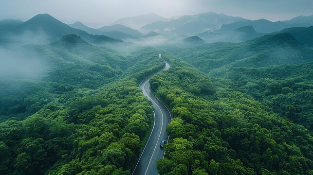 Scenic winding road through green mountains - generative ai