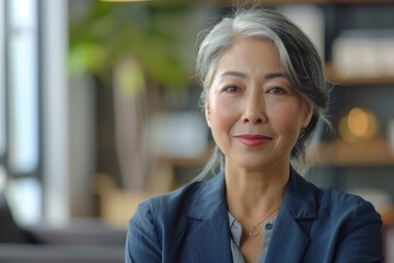 Fototapeta premium Portrait of a middle aged female worker in startup company office