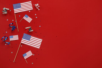 USA flags with stars and serpentine on red background. Independence Day celebration