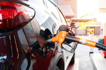 Car fueling at gas station. Refuel fill up with petrol gasoline. Petrol pump filling fuel nozzle in...