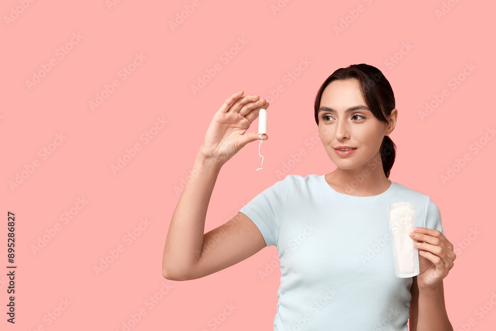 Sticker beautiful young woman with menstrual pad and tampon on pink background