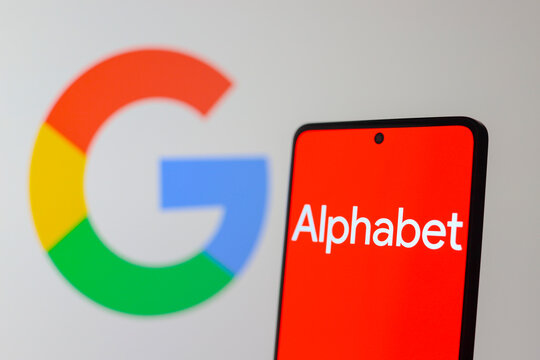 July 24, 2024, Paraguay. In this photo illustration, the Alphabet Inc. logo seen displayed on a smartphone screen and the Google logo in the background.