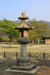 Bongdeok-ri, Jangheung-gun, Jeollanam-do, South Korea - April 15, 2015: Spring view of a stone lantern with fence at Borimsa Temple in the afternoon
