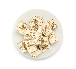 Plate with delicious cut feta cheese and spices on white background
