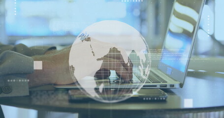 Image of globe with data processing over caucasian man using laptop