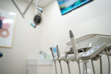 Dental office treatment room with dental tools.