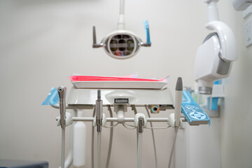 Dental office treatment room with dental tools.