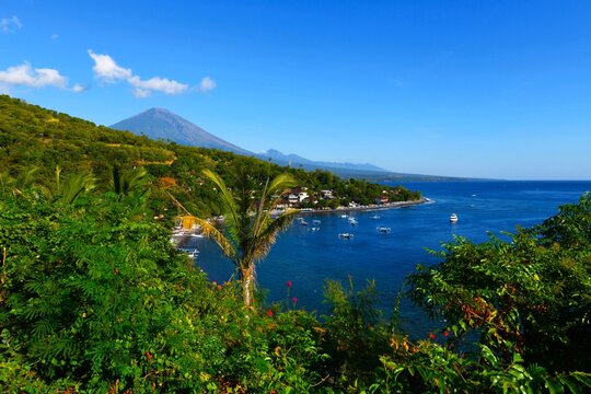 East coast of Bali - Jemeluk Beach and Amed village with the imposing active volcano Gunung Agung (3031 m) in the background (Kecamatan Abang Subdistrict, Karangasem Regency, Bali, Indonesia)