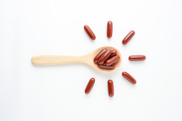 Vitamin capsules in a wooden spoon, soft gels, Fish oil capsules, omega 3, omega 9, vitamin D, vitamin E