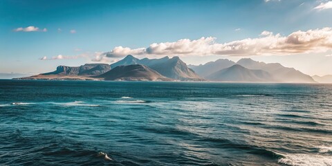 Scenic view of the ocean with towering mountains in the background, ocean, sea, water, mountain, scenic, view, landscape
