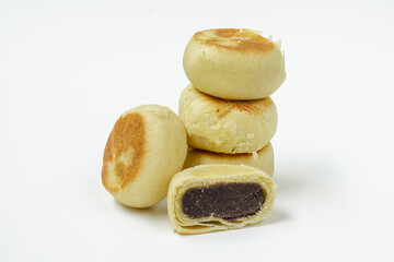 Bakpia is a food and souvenir typical of Yogyakarta made from a mixture of red beans or mung beans or cheese or yam coated with flour. That is an acculturation of Chinese culture. Isolated on white.