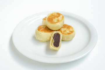 Bakpia, Bakpia Pathok kumbu hitam is a food and souvenir typical of Yogyakarta made from a mixture of red beans coated with flour. Isolated on white