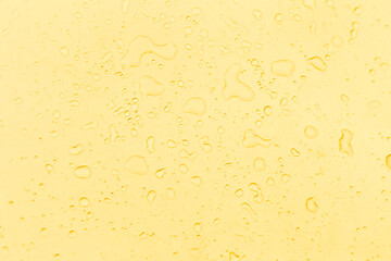 Water drops on yellow background, yellow water drops pattern background
