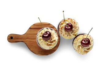 Wooden board with sweet cherry cupcakes on grey background