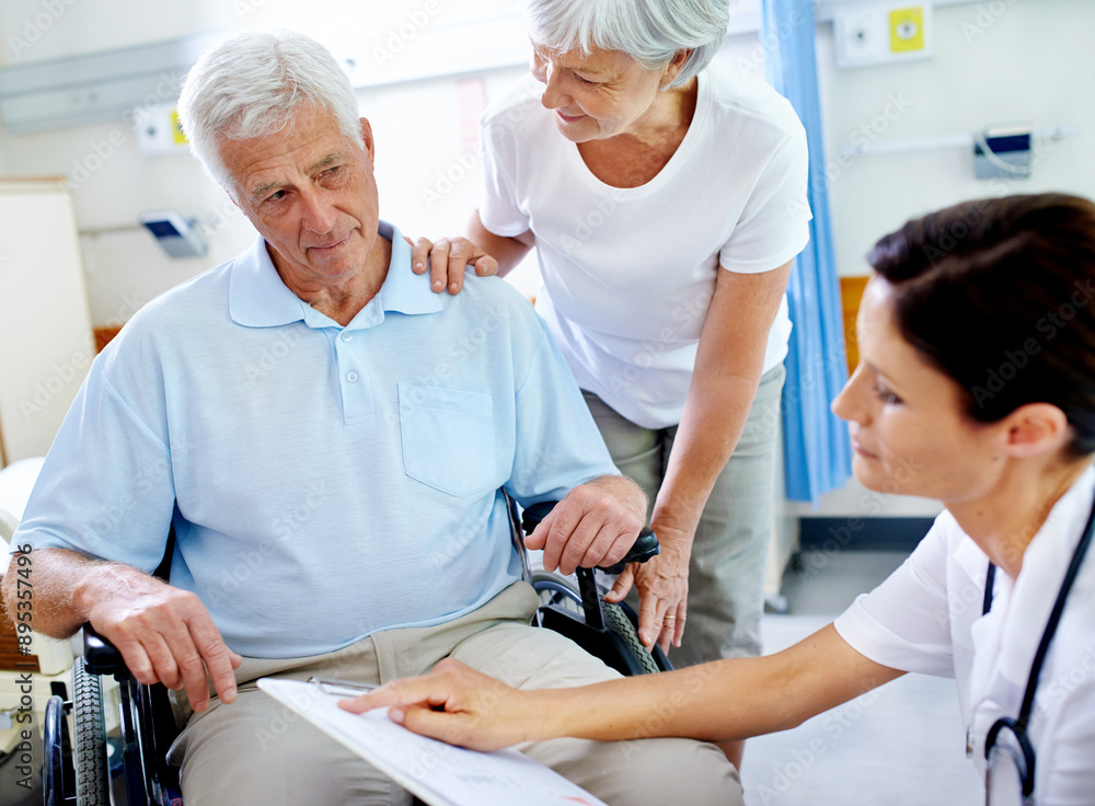 Wall mural Doctor, conversation and senior patient in wheelchair with a disability, happy and appointment with wife for support. Elderly man, medical worker and checklist for test results and progress notes.