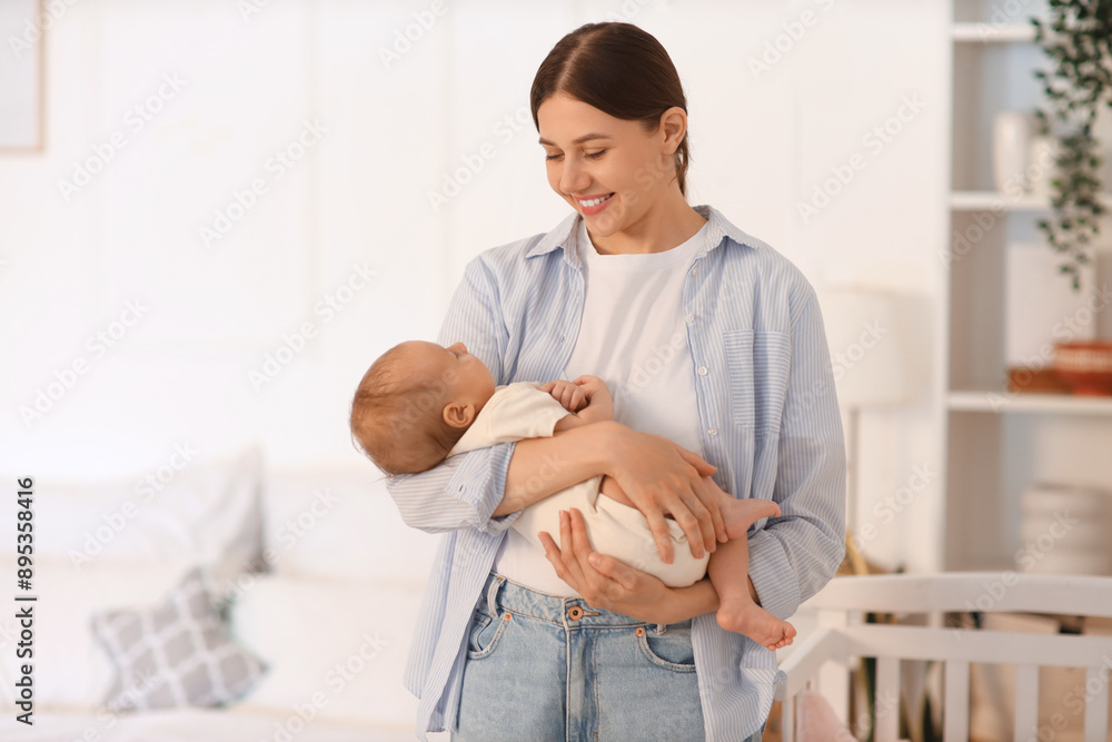 Poster Mother holding her little baby in bedroom