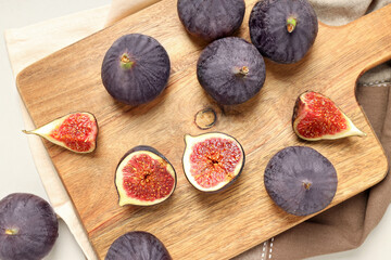 Fresh ripe figs on a wooden board