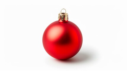A red ornament is sitting on a white background