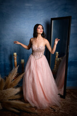 young woman with pink dress and princess style makeup. Mexican XV Years