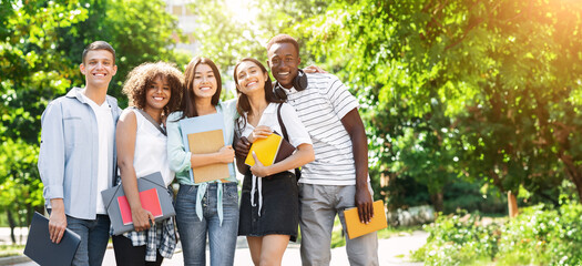 College Friendship Concept. Happy Multiethnic Group Of Students Posing Outdoors, Embracing And...
