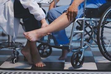 Obraz premium Asian young professional successful friendly female nurse in blue hospital uniform helping supporting physical therapy senior old pensioner unhealthy injury woman patient walking via four legs walker.