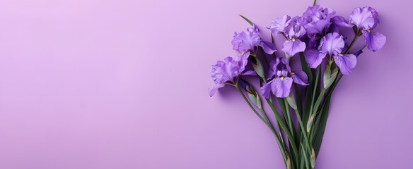 A bunch of purple flowers are arranged in a vase. The flowers are arranged in a way that they are all facing the same direction
