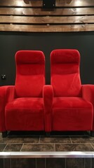 Obraz premium Cozy Red Velvet Theater Seats in Modern Home Cinema with Wooden Accents and Dark Walls