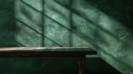 Blank table against dark green wall with window shadow and light reflections. Ideal for showcasing products.