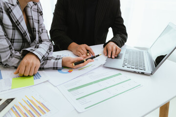 Close up of a team of business people having a meeting to analyze data for a marketing plan