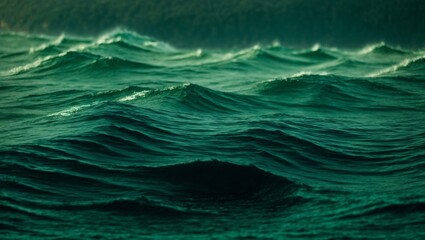 Emerald Ocean Surge: A captivating abstract image of the ocean's ebb and flow, showcasing the mesmerizing emerald green hues of the waves as they surge and crest. A serene yet powerful depiction of na