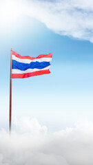 A red, white, and blue Thailand flag is flying