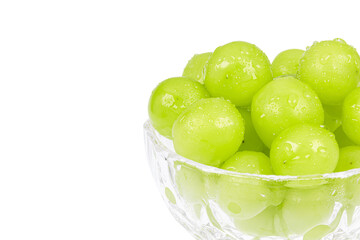 Fresh Shine Muscat grapes filled in a dessert bowl. white background - vitis vinifera 'shine muscat'