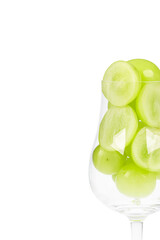 Fresh Shine Muscat grapes in a brandy glass. white background - vitis vinifera 'shine muscat'